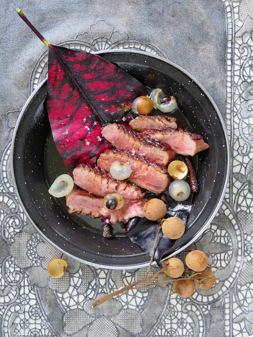 Fried duck breast with rum, lychees and long pepper (Mauritius)