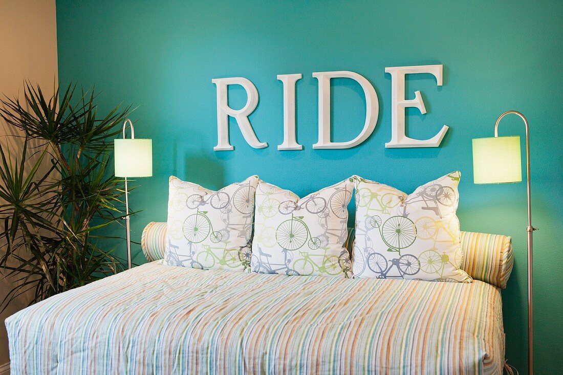 RIDE written on blue accent wall in bedroom; Azusa; California; USA