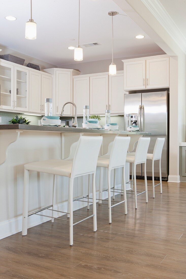 Row of bar stools at kitchen island