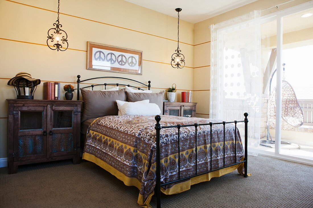 Bedroom with metal bed and cabinets; Valencia; California; USA