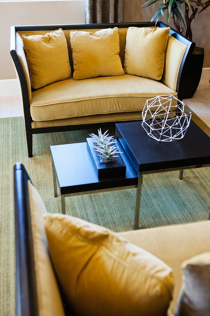 Two yellow sofas in living room; Valencia; California; USA