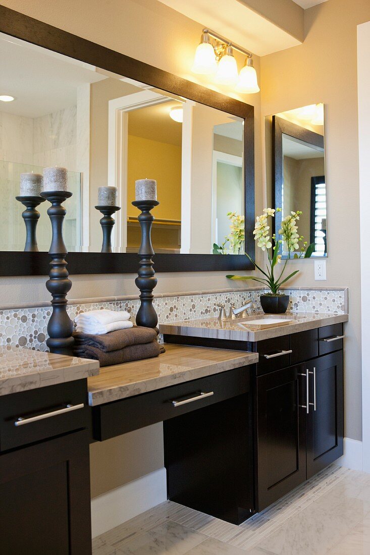 Interior of domestic bathroom with candlestick holders; Valencia; California; USA