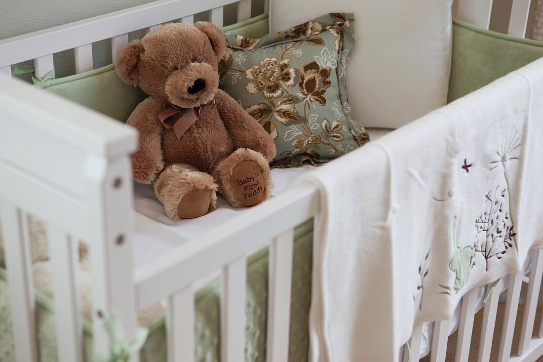 Close-up of soft toy in crib