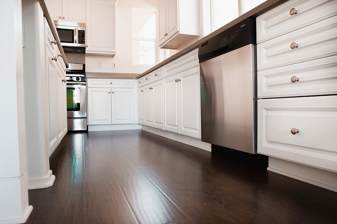 View of a kitchen with white cabinets; Ontario; California; USA