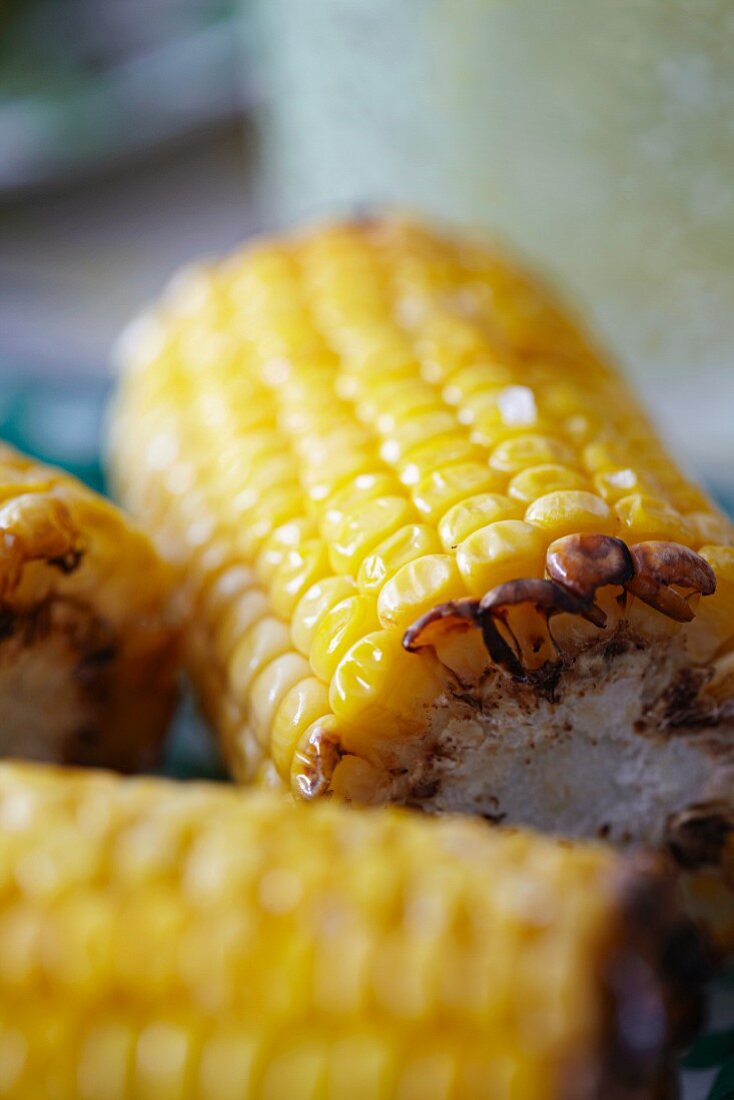 A close-up of baked corn cobs