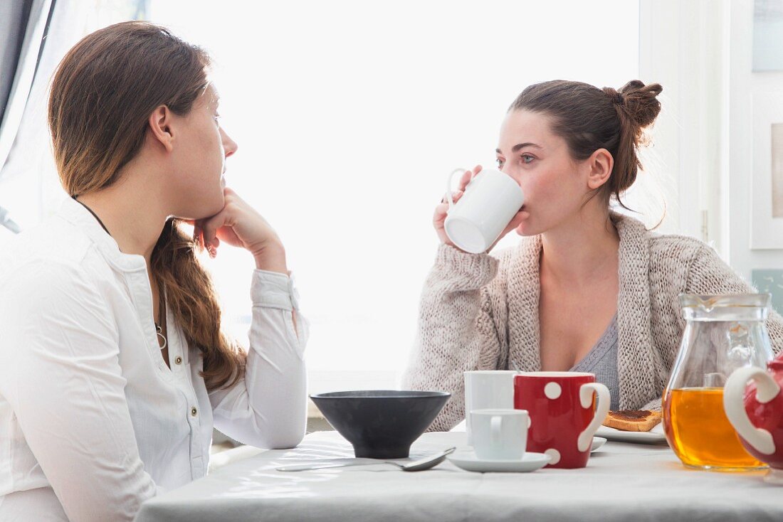 Two young women having breakfast