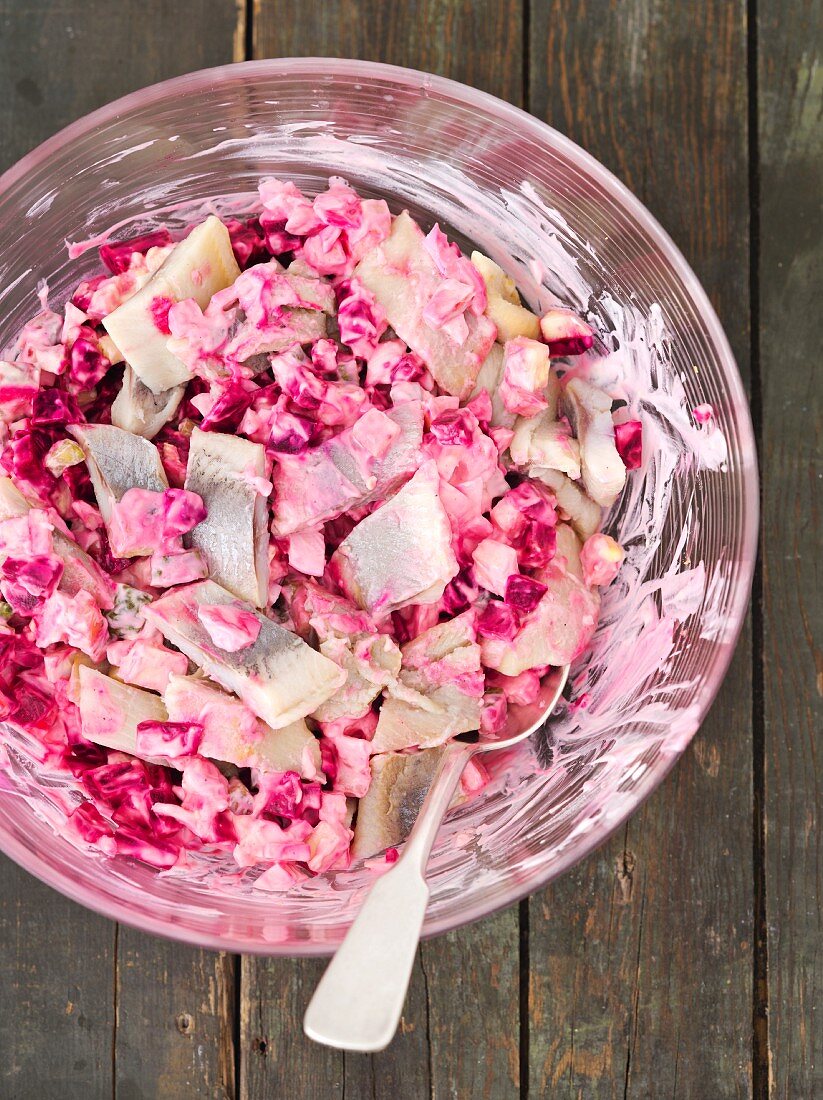 Herring salad with beetroot, gherkins, egg, apple and mayonnaise