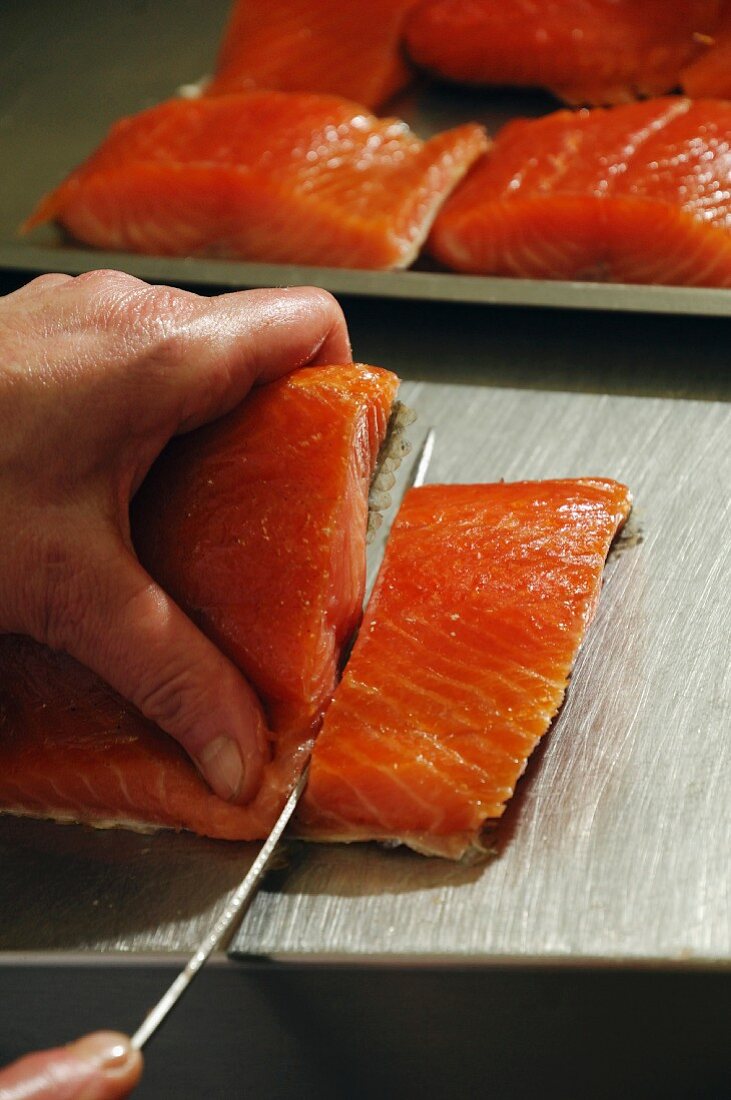 Smoked salmon being sliced