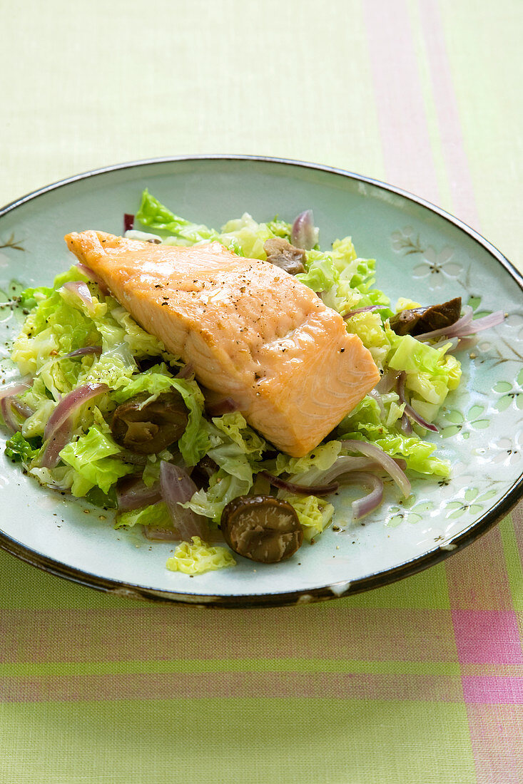 Grilled salmon on a bed of braised cabbage with chestnuts