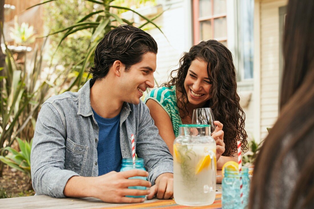 A young couple drinking homemade lemonade