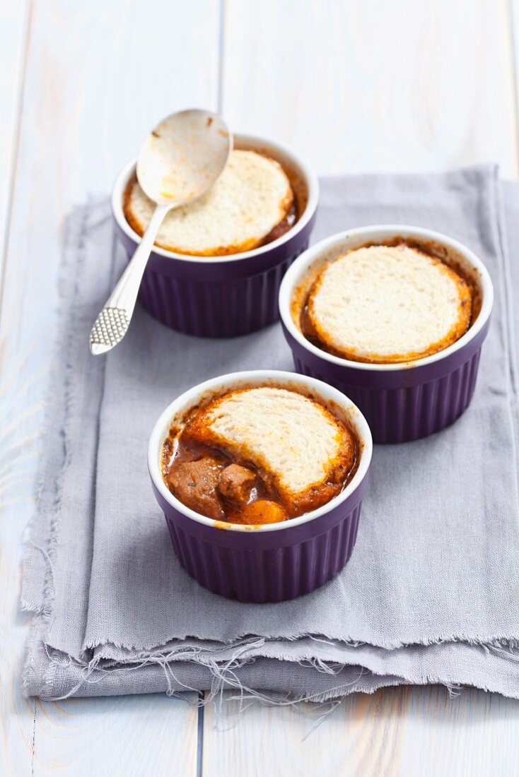 Beef goulash topped with toast