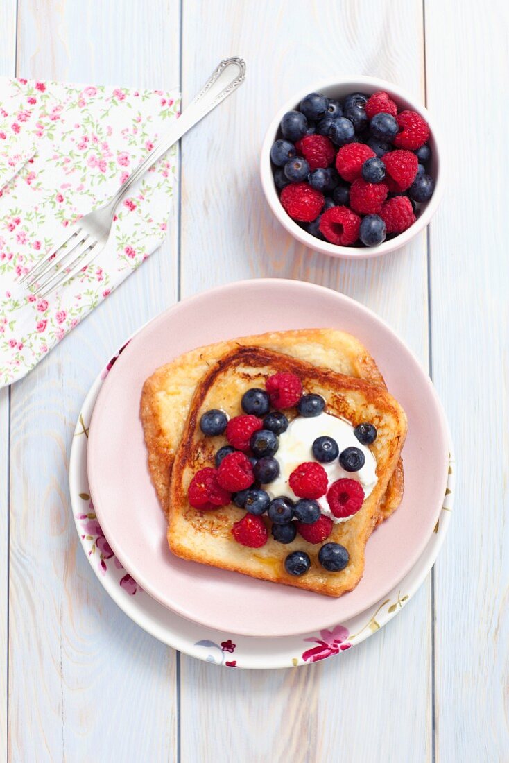 French toast with maple syrup, berries and yoghurt