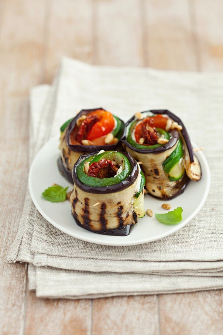 Grilled aubergine and courgette rolls filled with dried tomatoes and cream cheese