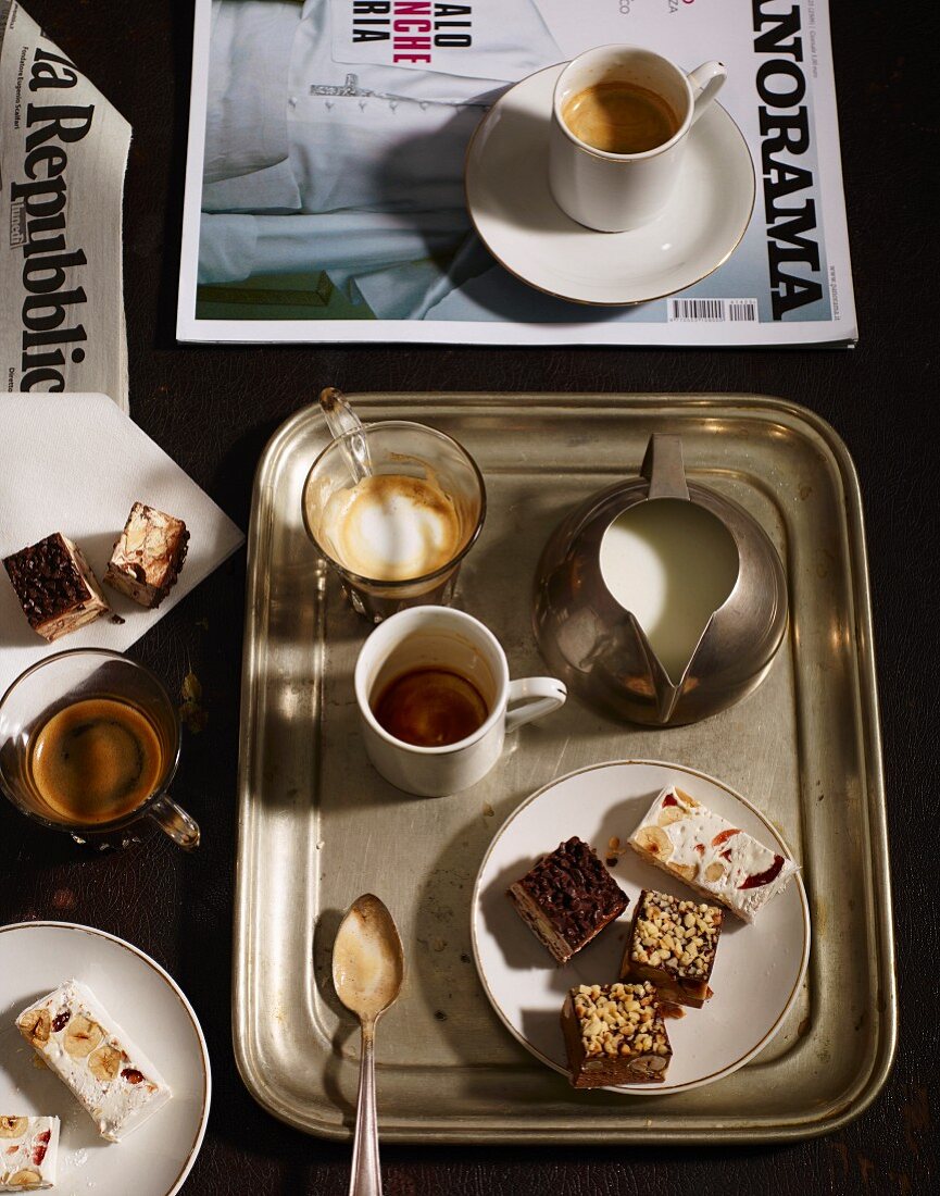 Coffee, milk and nougat on a tray