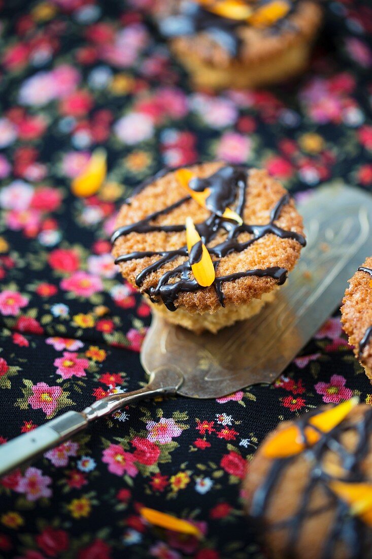Marigold cupcakes decorated with marigold petals and chocolate