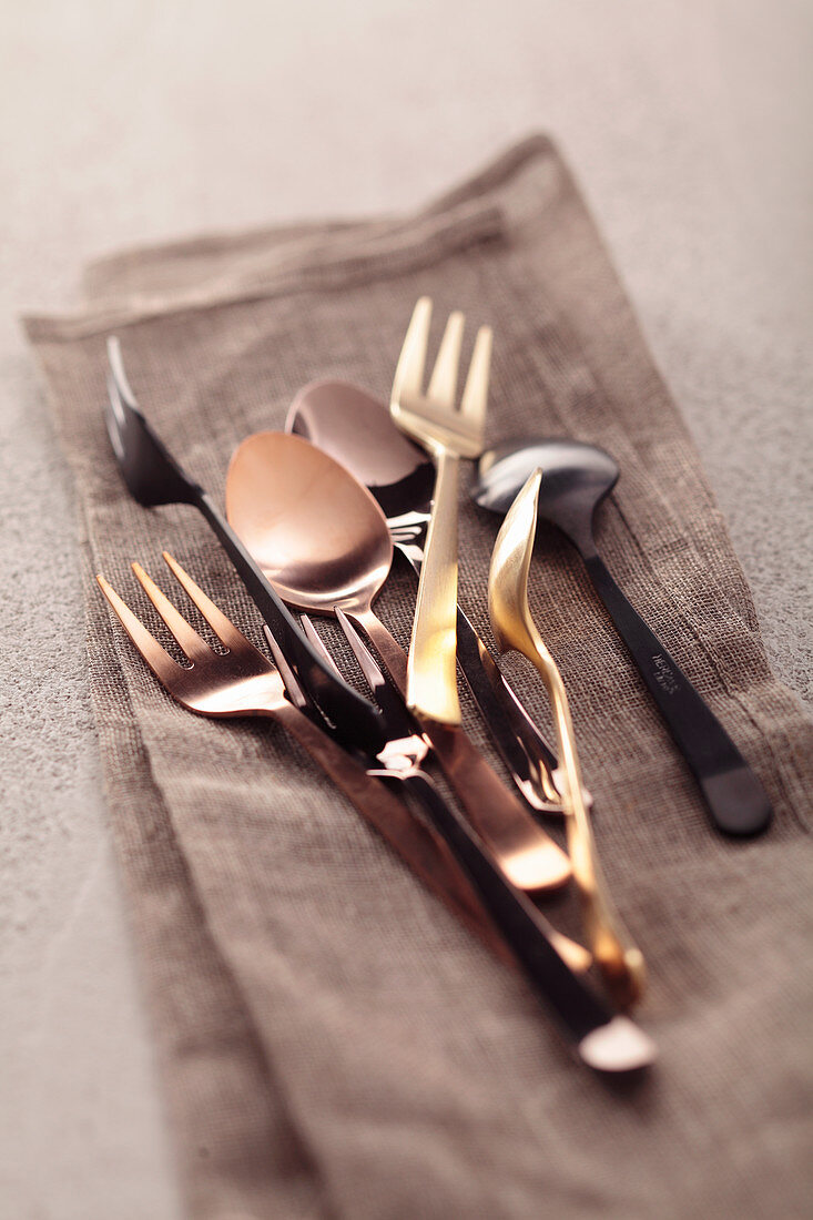 Cake forks and spoons on a napkin