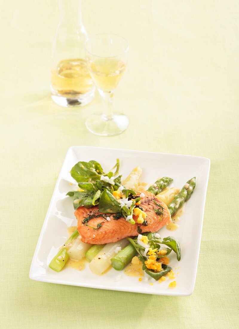 Salmon fillet on an asparagus salad