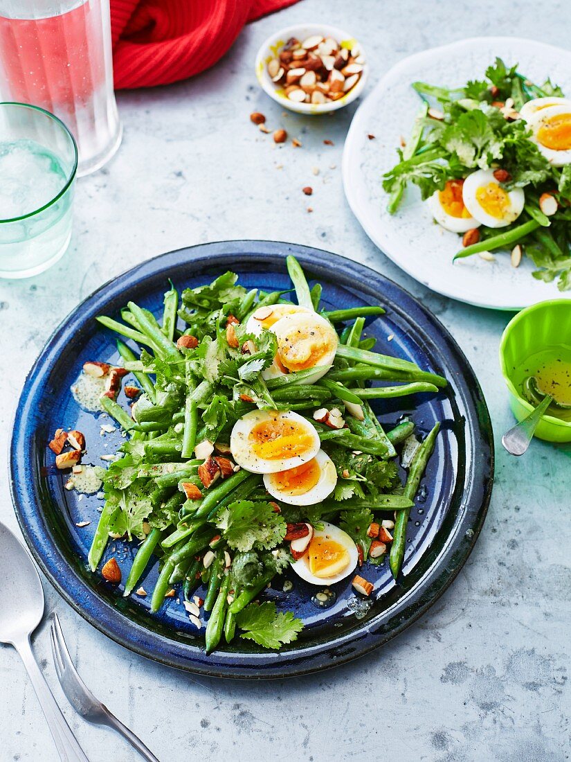 Bean salad with hard-boiled egg, coriander and almonds