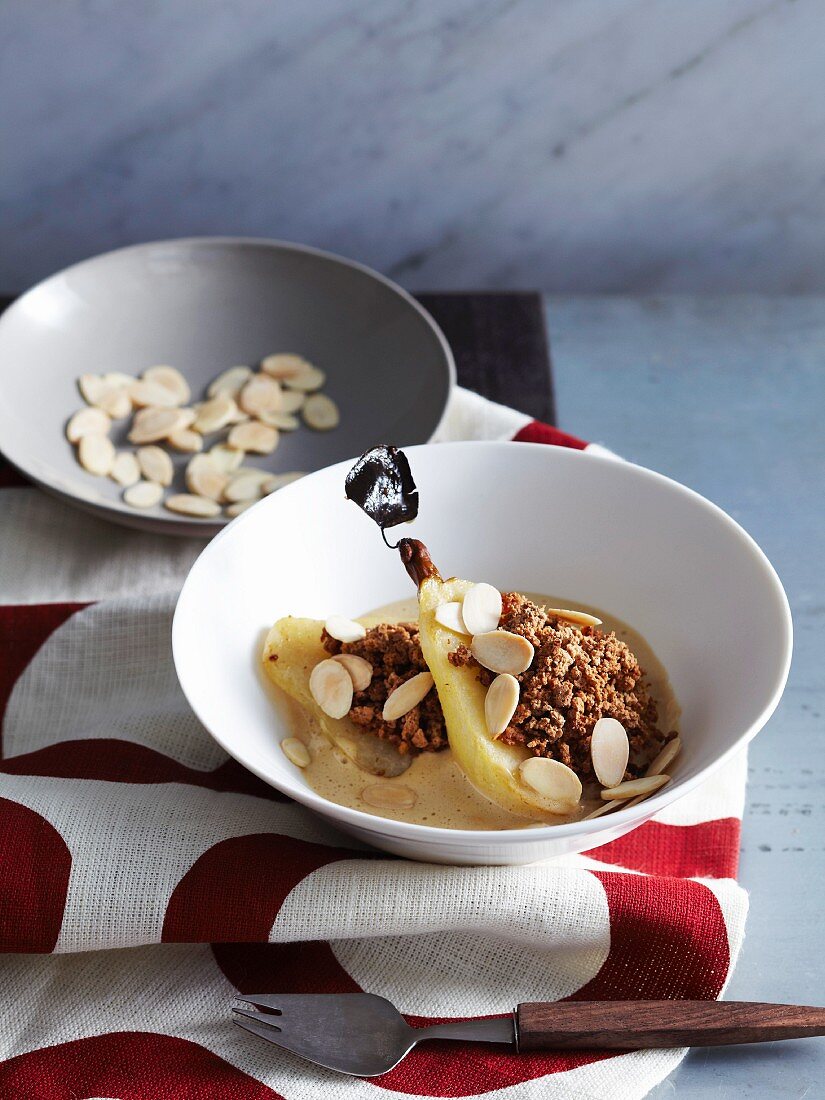 Amaretto pears with chocolate crumble and almonds in sabayon