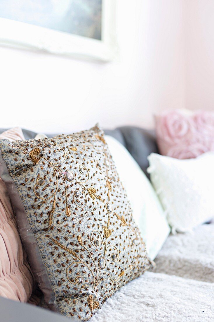 Embroidered cushion on sofa