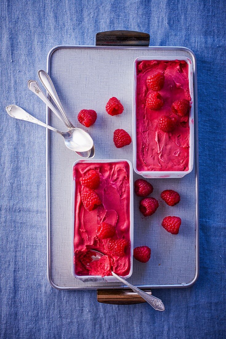 Raspberry sorbet in ice cream containers