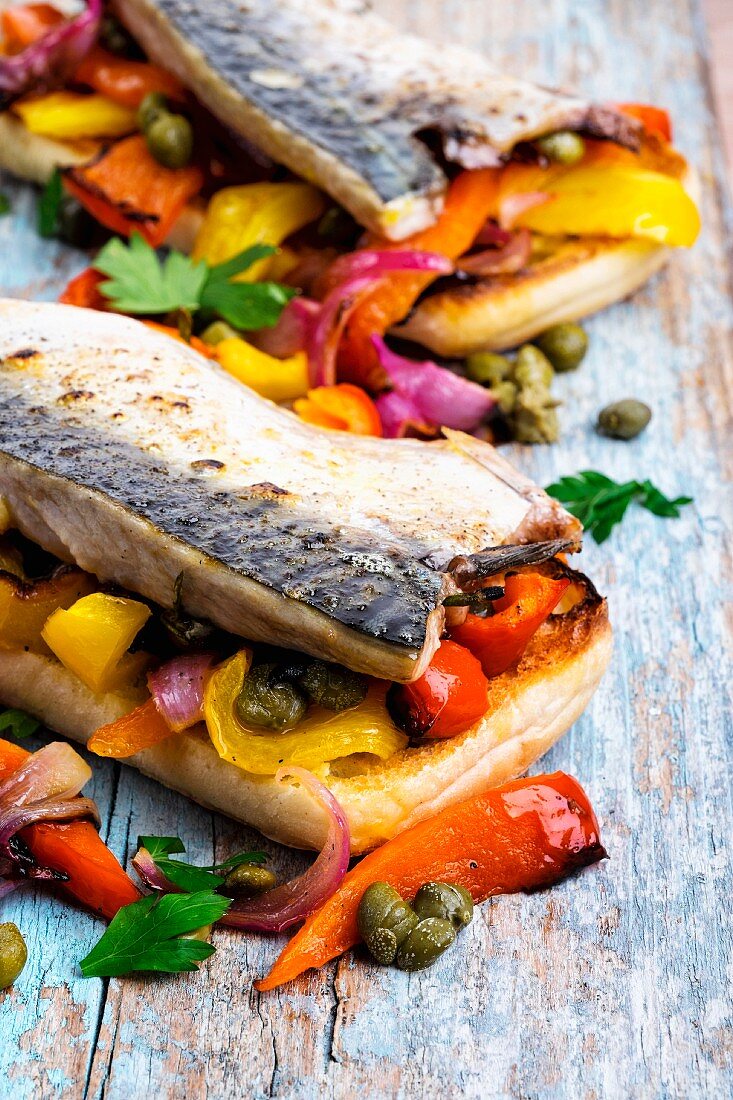 Grilled mackerel with peppers and capers on toast