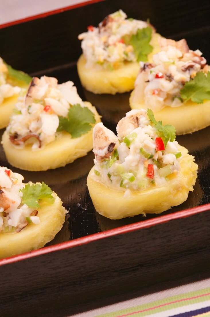 Crab salad on pineapple slices