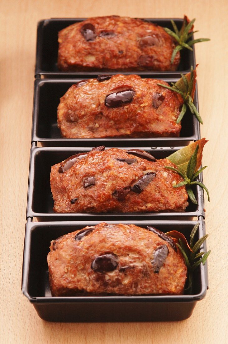 Individual meat loaves with olives and rosemary