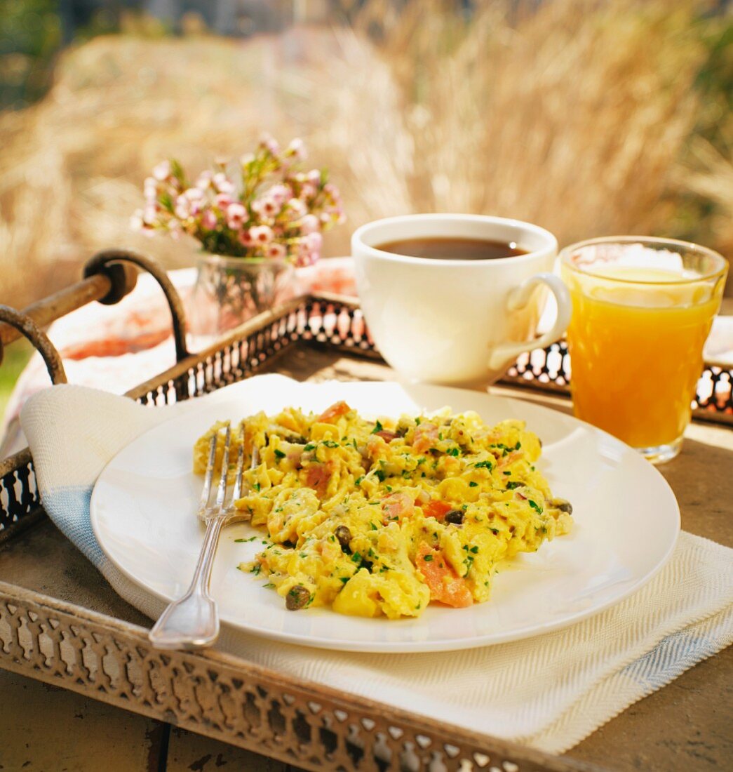 Breakfast with scrambled eggs, coffee and orange juice for Mother's Day