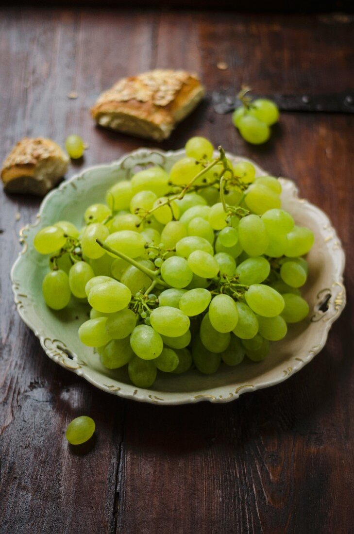 Green grapes and slices of bread