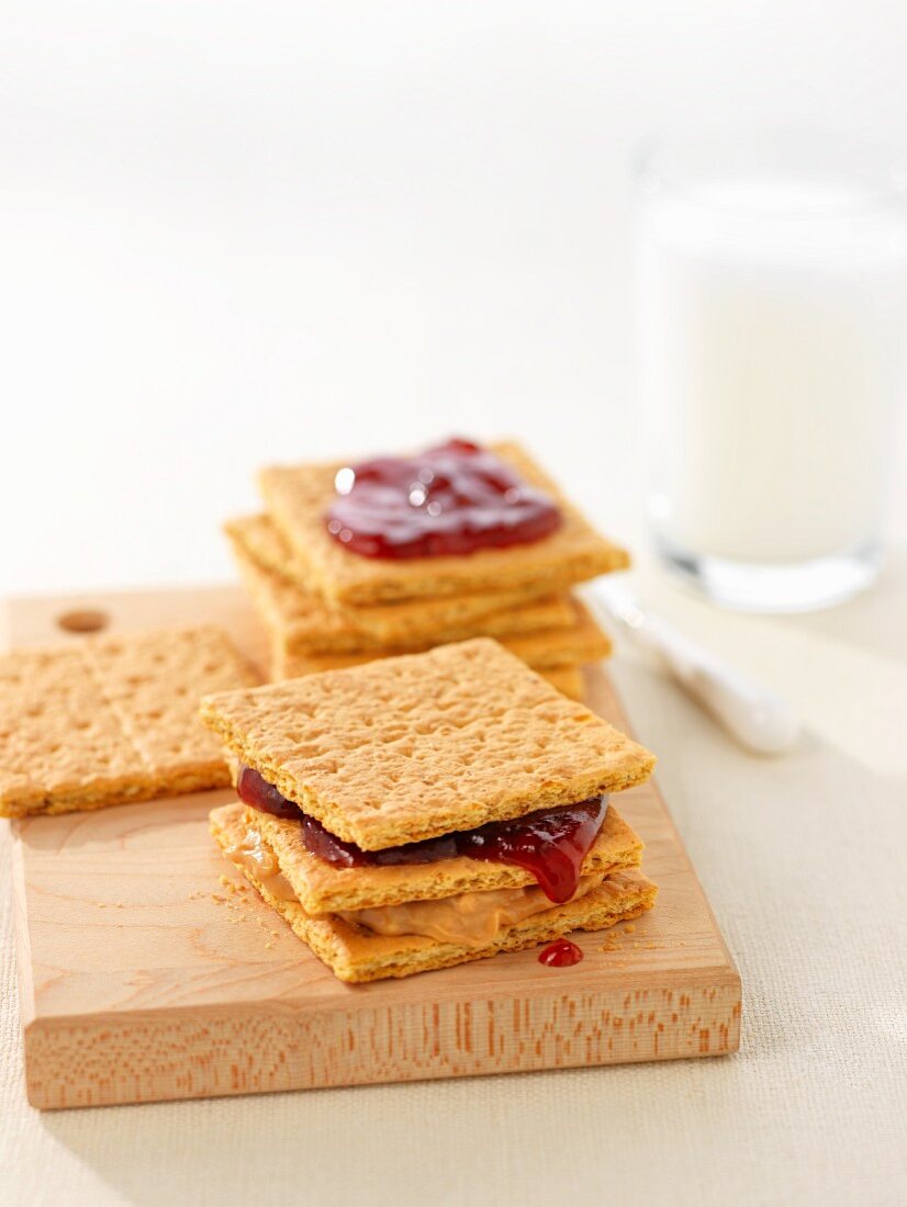 Crackers with peanut butter and jam