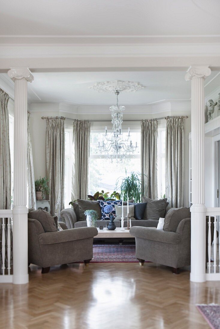 Elegant living room with grey sofa set in villa