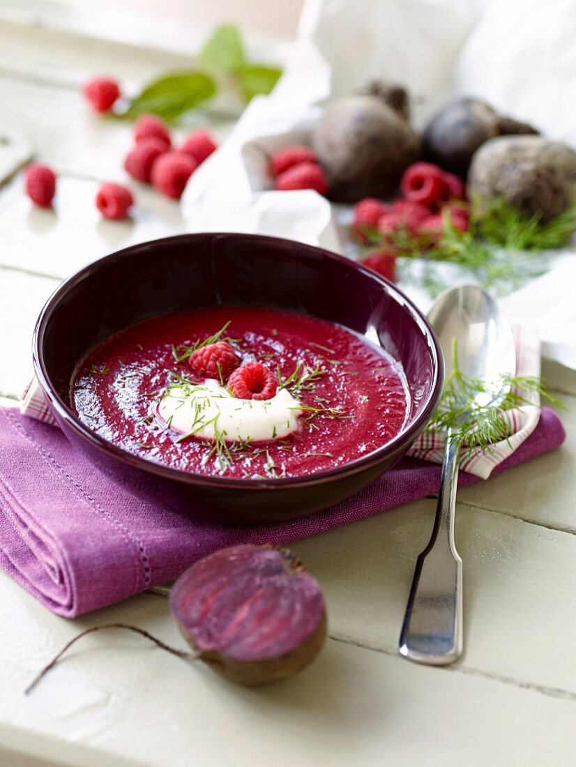 Beetroot soup with raspberries, sour cream and dill