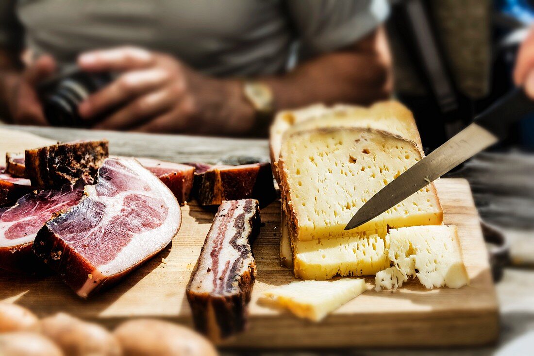 Streaky bacon and cheese and wooden board for supper