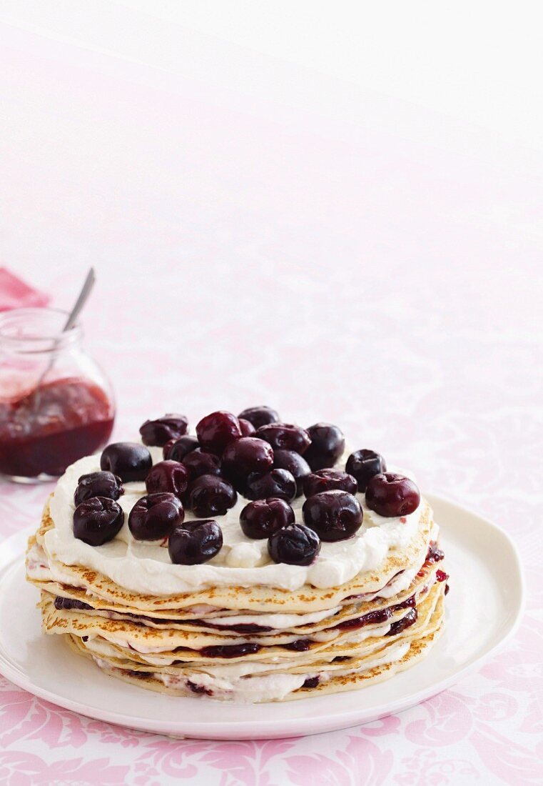 Crêpe stack cake with cream and cherries