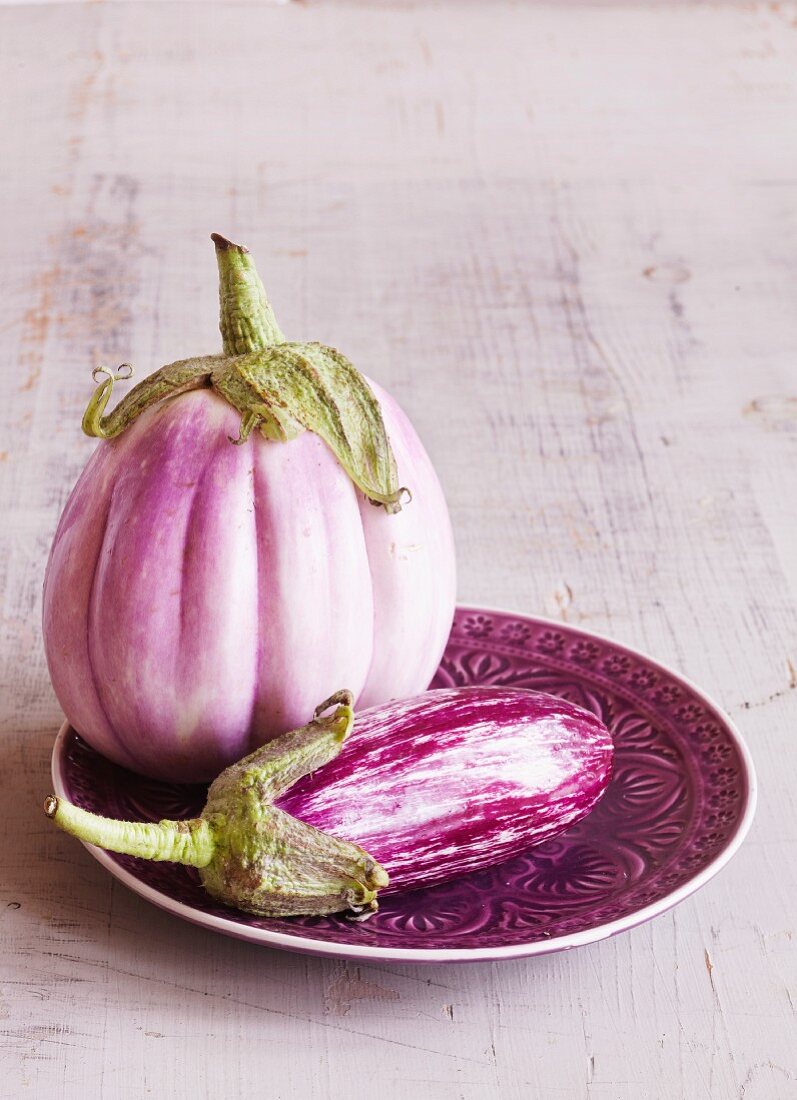 Pink aubergines on a plate