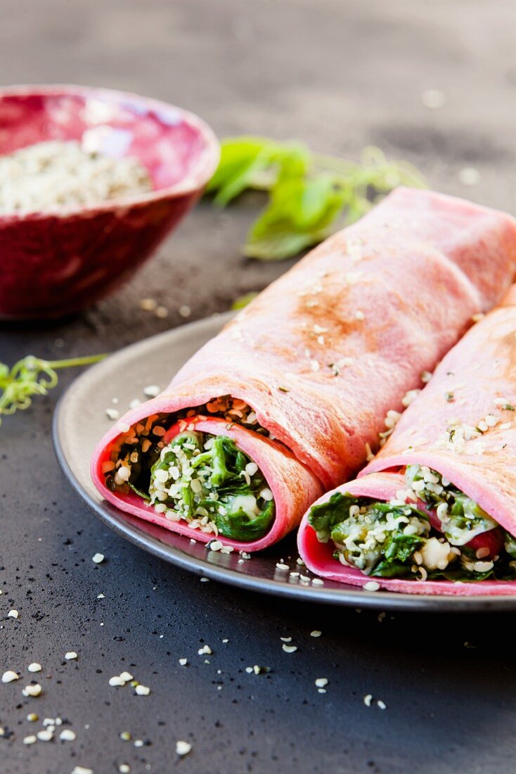 Beetroot crêpes filled with mozzarella and spinach