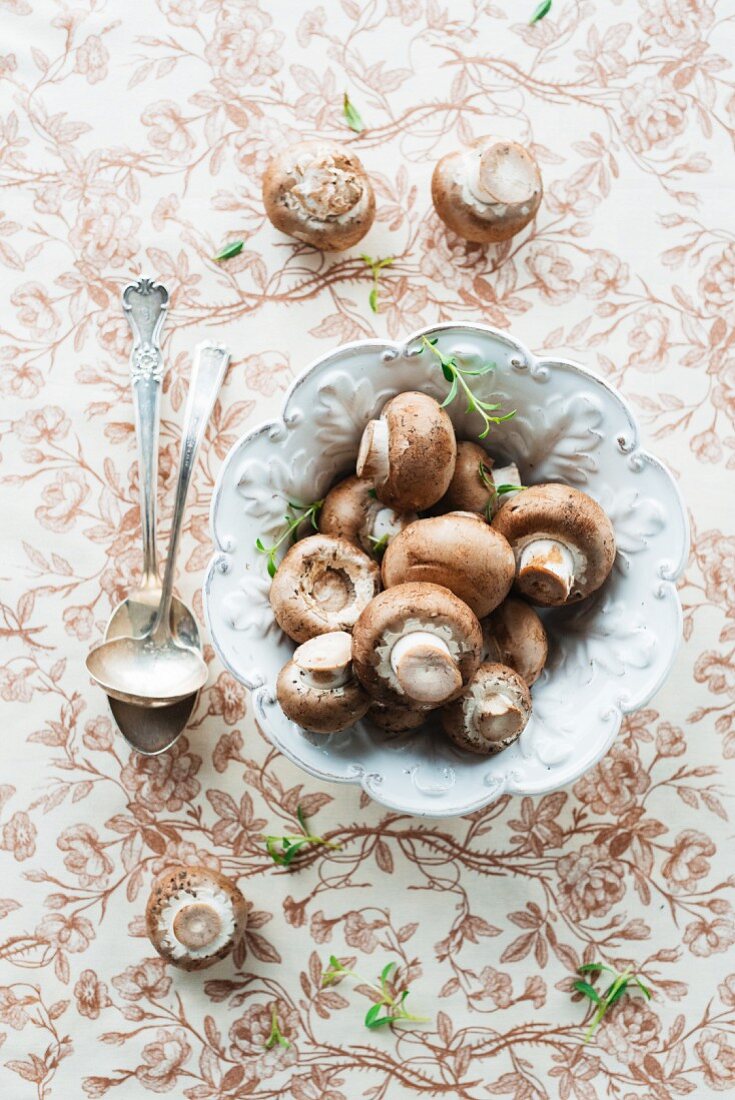 Brown mushrooms in a ceramic dish