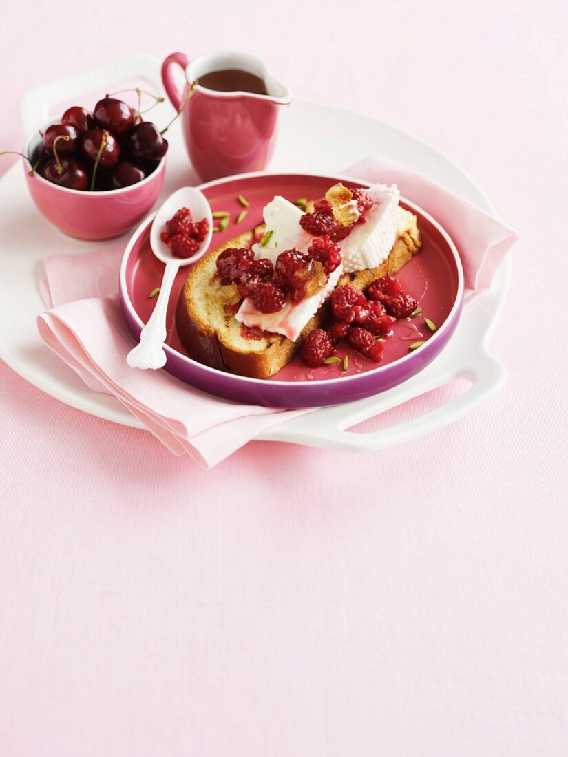 Bruschetta topped with ricotta and raspberries
