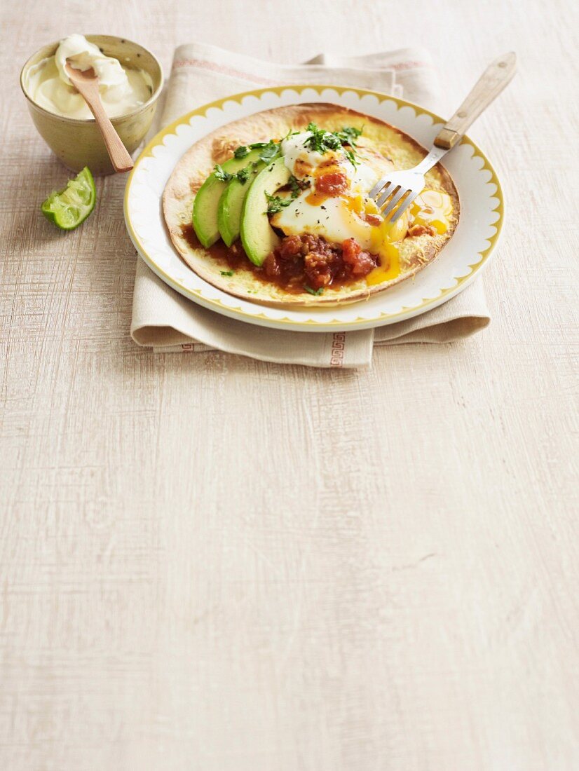 Eggs with tacos and avocado for breakfast (Mexico)