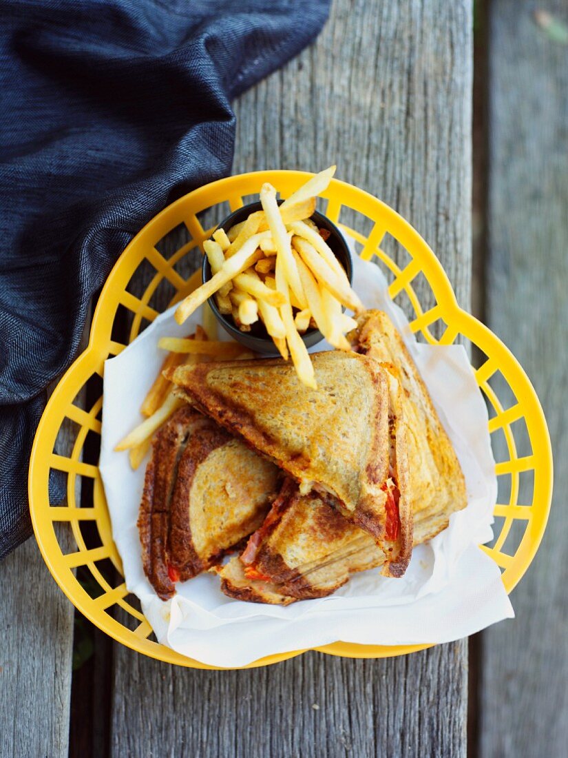 Ham and cheese toasties with chilli peppers and fries