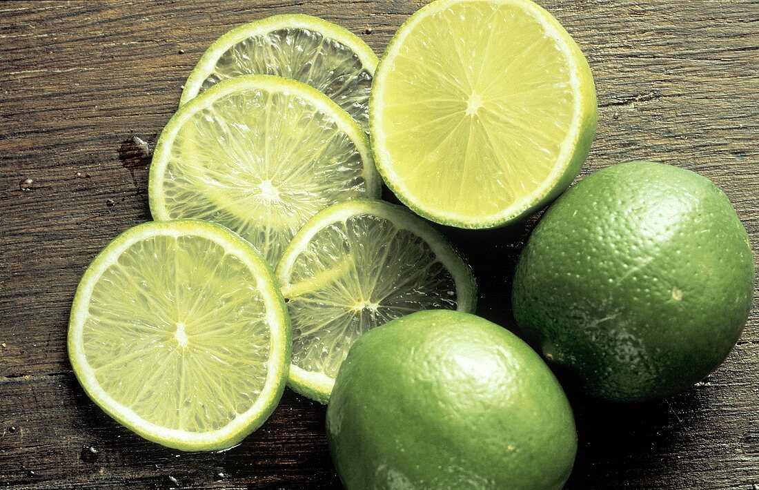 Two Whole Limes; Lime Half and Lime Slices