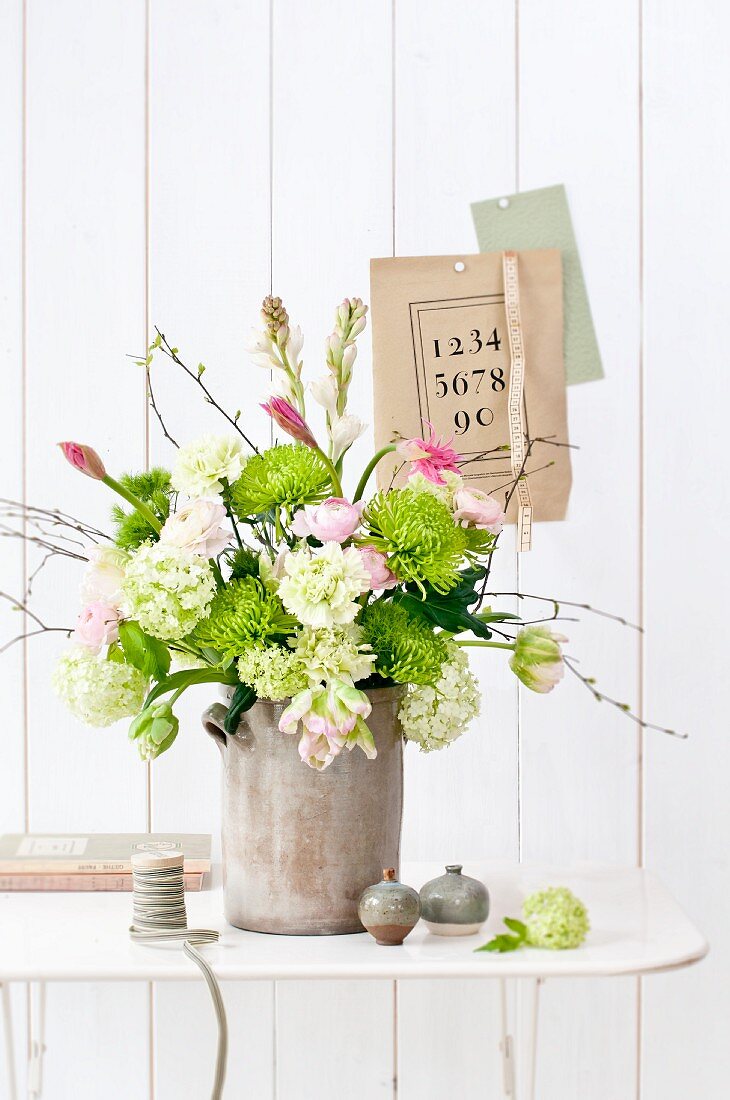 Large bouquet of chrysanthemums, viburnum, parrot tulips, birch twigs, nerine lilies and tuberose flowers