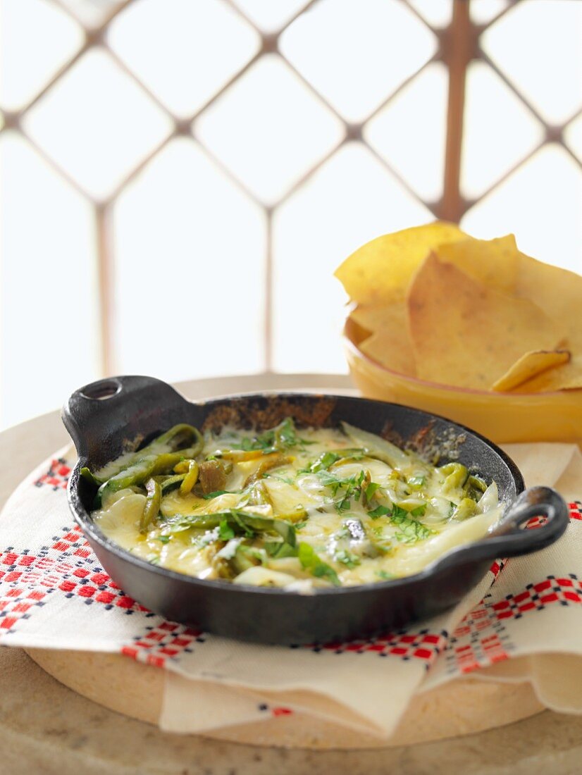 Queso Fundido (melted cheese, Mexico) with tortilla chips