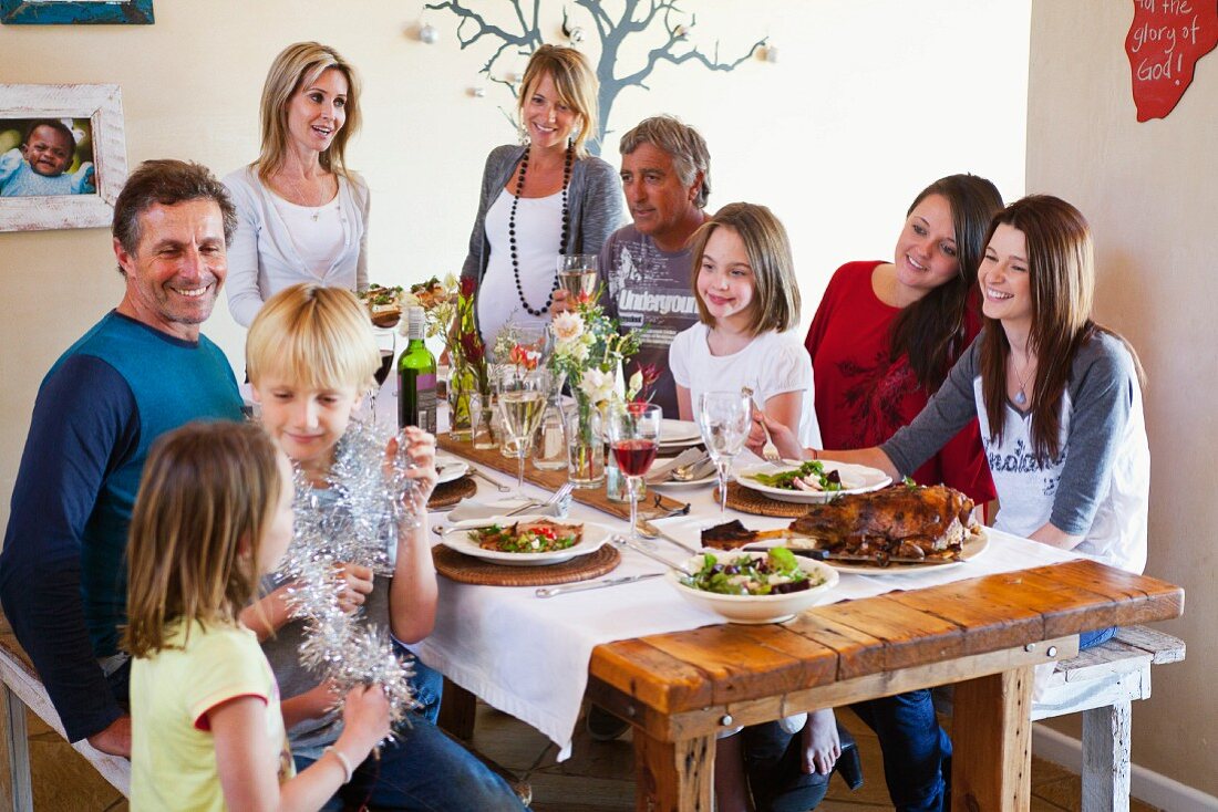 A family sitting down for Christmas dinner