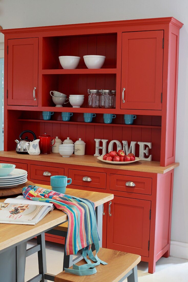 Red dresser in kitchen