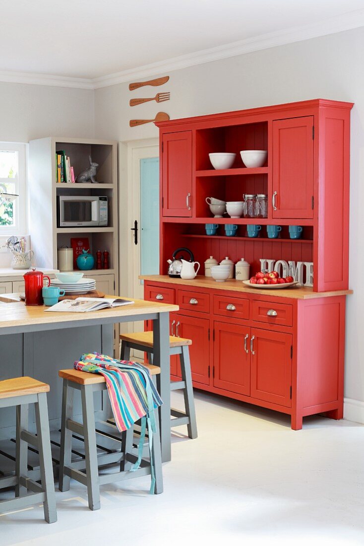 Red dresser in kitchen