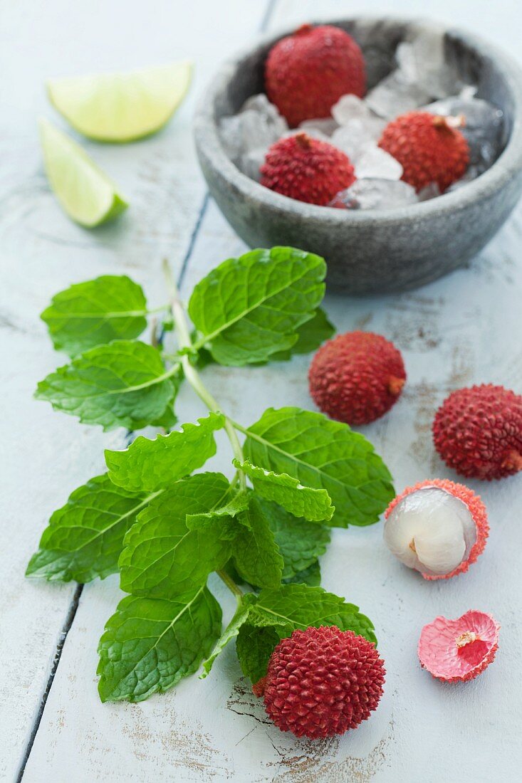 Fresh lychees, mint and lime wedges