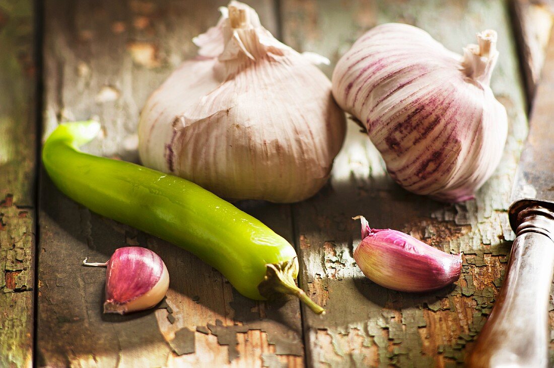 Pink garlic and a green chilli pepper