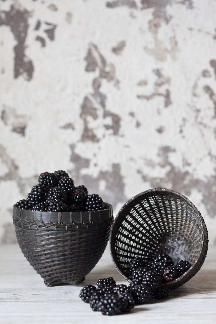 Fresh blackberries in black baskets